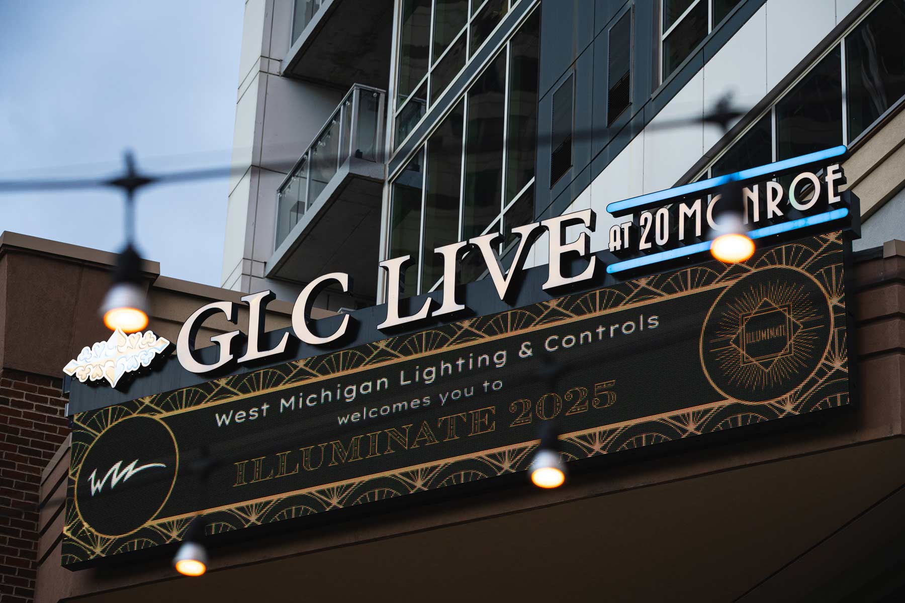 closeup of sign for glc live at 20 monroe west michigan lighting and controls welcomes you to illuminate 2025